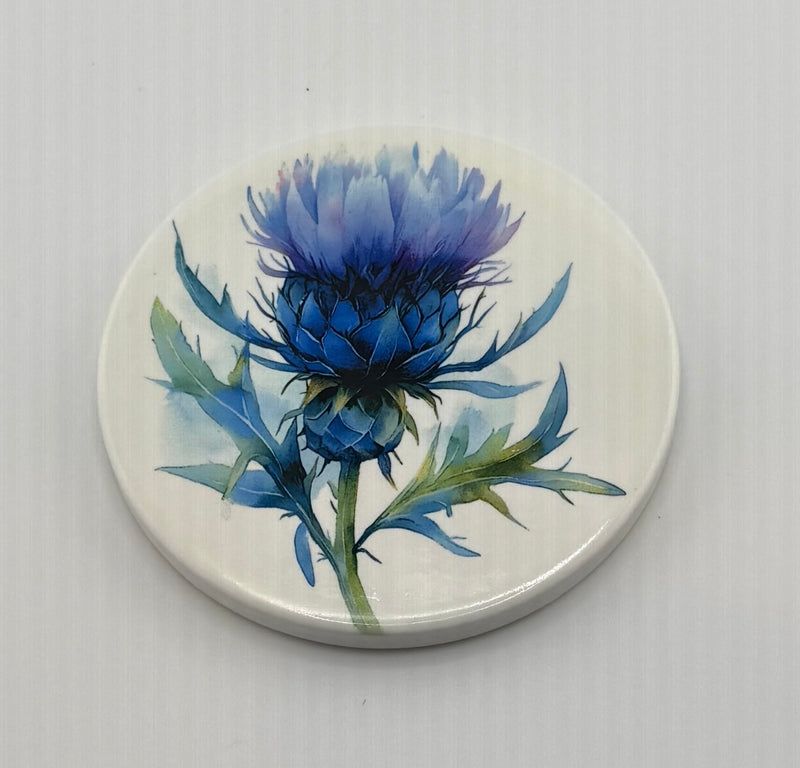 Coaster. Custom Thistle (Blue) Designs may vary.