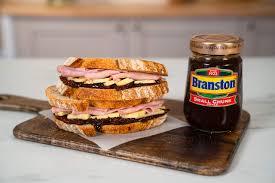 Branston Small Chunk Pickle is an alternative to the standard Branston Pickle, its smaller chunks lending themselves perfectly to sandwiches due to their easy spreading. Made with quality ingredients, this 360g jar is packed with chunks of delicious vegetables and secret spices. Perfect for adding a zesty kick to sandwiches, meats, or sauces. Elevate your meals with the expertise of a traditional British favorite.