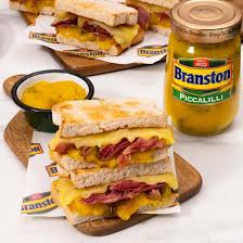 <p>Introduce your taste buds to Branston Piccalilli, the mouth-watering condiment that adds a burst of flavor to any dish! Made with a unique blend of vegetables and spices, this 360g jar is packed with 100% natural ingredients. Elevate your meals with the delicious tangy taste of Branston Piccalilli.</p> <p><span>Suitable for Vegans. Suitable for Vegetarians</span></p>